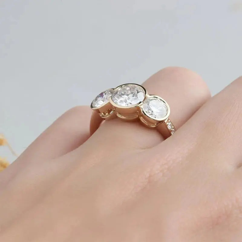 14K YELLOW GOLD MOISSANITE BEZEL SET THREE STONE ENGAGEMENT RING Moissanite Engagement Rings & Jewelry | Luxus Moissanite